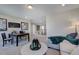 Cozy living area with plush seating, office space, and bright lighting perfect for relaxing or working at 124 Seagraves Creek Ln, Holly Springs, NC 27540