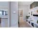 Convenient mudroom with built-in storage, seating, and easy access to the living area at 124 Seagraves Creek Ln, Holly Springs, NC 27540
