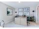 Home office featuring a large desk, modern art, shelving, and neutral colors at 124 Seagraves Creek Ln, Holly Springs, NC 27540