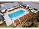 Aerial view of community pool with pergola covered lounge area at 124 Seagraves Creek Ln, Holly Springs, NC 27540
