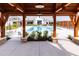 View of community pool through the frame of a covered lounge area at 124 Seagraves Creek Ln, Holly Springs, NC 27540