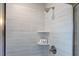 This tiled shower has tiled shelving, and chrome hardware and accents at 124 Seagraves Creek Ln, Holly Springs, NC 27540