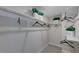 This walk-in closet features white shelves and hanging rods for optimal storage at 124 Seagraves Creek Ln, Holly Springs, NC 27540