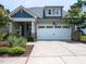 Charming home featuring an attached two car garage and meticulously landscaped front yard at 12421 Angel Vale Pl, Durham, NC 27703
