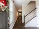 The inviting foyer features hardwood floors and a staircase to the second level at 12421 Angel Vale Pl, Durham, NC 27703
