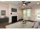 Inviting living room featuring hardwood floors, a fireplace, and plenty of space for entertaining at 12421 Angel Vale Pl, Durham, NC 27703