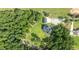 Beautiful aerial view of the property showcasing lawn and surrounding trees at 125 Attena Way, Zebulon, NC 27597