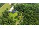 An aerial view of a home with lush surroundings and beautiful lawn at 125 Attena Way, Zebulon, NC 27597