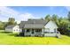 Aerial view of the home showcasing the backyard, deck, patio, and overall property layout at 125 Attena Way, Zebulon, NC 27597