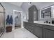 Bathroom boasting double sinks, gray cabinets, walk-in shower, and neutral colors at 125 Attena Way, Zebulon, NC 27597