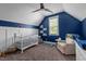 Charming Bedroom with wainscoting, a crib, a ceiling fan, and neutral carpet at 125 Attena Way, Zebulon, NC 27597