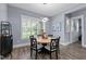Cozy dining area with a round table, stylish chairs, and a modern chandelier at 125 Attena Way, Zebulon, NC 27597