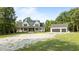 New home with an expansive gravel driveway and two-car garage at 125 Attena Way, Zebulon, NC 27597