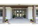 Elegant entryway with a double door, stone accents, and decorative wreaths at 125 Attena Way, Zebulon, NC 27597