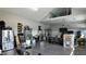 Spacious three-car garage with epoxy floors, storage, and work area at 125 Attena Way, Zebulon, NC 27597