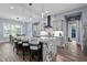 Spacious kitchen with a large island, granite countertops, and barstool seating at 125 Attena Way, Zebulon, NC 27597