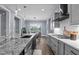 Bright and airy kitchen with granite countertops, modern appliances, and an open floor plan at 125 Attena Way, Zebulon, NC 27597