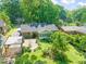 Aerial view of home featuring a patio, pergola, garden, and well-maintained lawn at 1311 Norton St, Durham, NC 27701