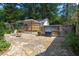 Backyard patio features stone pavers, pergola, fenced in yard, and outdoor grill at 1311 Norton St, Durham, NC 27701