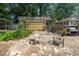 Backyard patio featuring stone pavers, outdoor seating, and wood pergola at 1311 Norton St, Durham, NC 27701