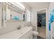 Bathroom featuring a vanity, framed mirror, and blue floral shower curtain at 1311 Norton St, Durham, NC 27701