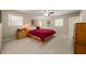 Bright bedroom with neutral walls features a platform bed and natural light from two windows at 1311 Norton St, Durham, NC 27701