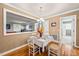 Cozy dining room with white table and chairs, neutral walls, and view to adjacent living space at 1311 Norton St, Durham, NC 27701