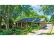 Beautiful brick home with a well-manicured lawn, charming front porch, and lovely landscaping at 1311 Norton St, Durham, NC 27701