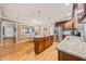Bright kitchen featuring a large island, stainless steel appliances, and an open floor plan at 1311 Norton St, Durham, NC 27701