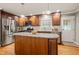 Beautiful kitchen with an island, stainless steel appliances, and wooden cabinets at 1311 Norton St, Durham, NC 27701