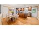 Spacious kitchen and dining area with a wooden table and stainless steel appliances at 1311 Norton St, Durham, NC 27701