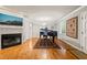 Elegant living room featuring a fireplace, piano, and light gray walls at 1311 Norton St, Durham, NC 27701