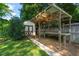 Backyard shed with covered workstation and landscaped yard at 1311 Norton St, Durham, NC 27701