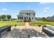 Enjoy outdoor living on the patio, with an outdoor dining area and beautiful backyard at 1321 White Spruce Dr, Willow Springs, NC 27592