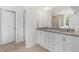Bright bathroom featuring double sinks, granite countertops, and ample storage at 1321 White Spruce Dr, Willow Springs, NC 27592