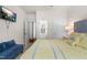 Inviting bedroom featuring a plush bed and a doorway leading to an ensuite bathroom at 1321 White Spruce Dr, Willow Springs, NC 27592