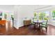 Inviting dining room featuring hardwood floors and large windows with a view to the outdoors at 1321 White Spruce Dr, Willow Springs, NC 27592
