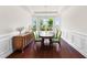 Bright dining room with hardwood floors, molding, and bay windows overlooking the yard at 1321 White Spruce Dr, Willow Springs, NC 27592