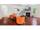 Bright living room with fireplace, large TV, hardwood floors, and lots of natural light at 1321 White Spruce Dr, Willow Springs, NC 27592