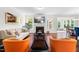 Bright living room with a cozy fireplace, modern furniture, and hardwood floors at 1321 White Spruce Dr, Willow Springs, NC 27592