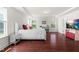 Spacious main bedroom with tray ceiling, wood floors, and serene window views at 1321 White Spruce Dr, Willow Springs, NC 27592