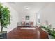 Bright sitting room boasts wood floors, natural light, and charming decor accents at 1321 White Spruce Dr, Willow Springs, NC 27592