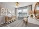 Bright Bedroom with alphabet and animal artwork, a cozy rocking chair, and natural light at 1472 Hasse Ave, Apex, NC 27502