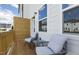 Outdoor deck with wood flooring, white siding, and patio furniture at 1472 Hasse Ave, Apex, NC 27502