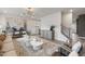 Open living area featuring stylish decor, wood-look floors and bright natural light at 1472 Hasse Ave, Apex, NC 27502