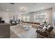 Spacious living room featuring neutral tones, elegant furniture, and ample natural light at 1472 Hasse Ave, Apex, NC 27502