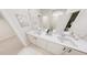 Bathroom featuring a double vanity with white cabinets, quartz countertops, and modern fixtures at 154 Beacon Dr, Pittsboro, NC 27312