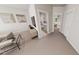 Open-concept living room with sleek console, views to the bathroom and bedroom, and neutral palette at 154 Beacon Dr, Pittsboro, NC 27312
