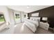 Inviting main bedroom with neutral tones, large windows, a comfortable bed, and ample natural light at 154 Beacon Dr, Pittsboro, NC 27312