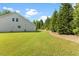 Backyard with a border of trees at 1705 Bodwin Ln, Apex, NC 27502
